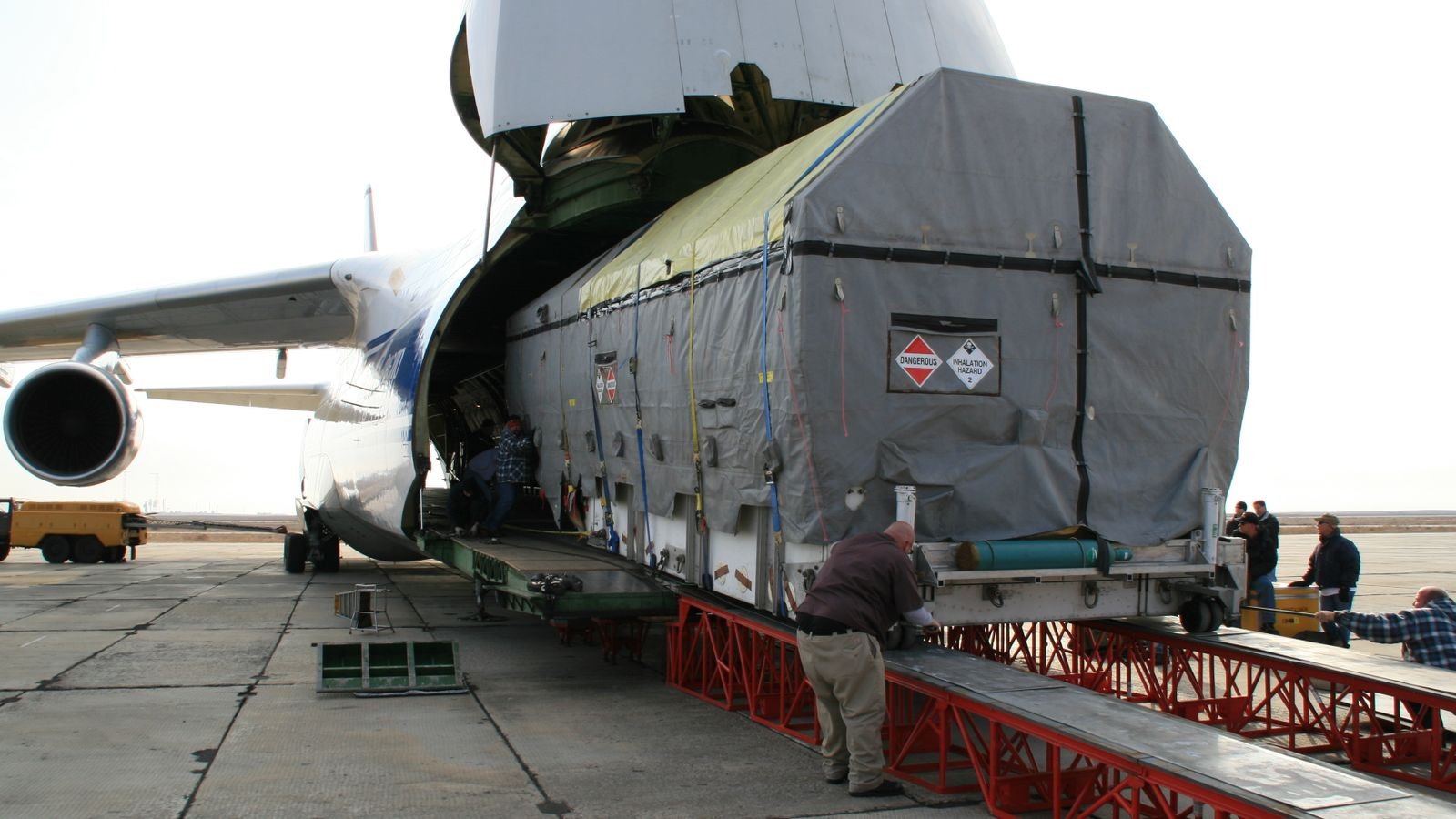 Cargo freighter being loaded with air freight on the tarmac